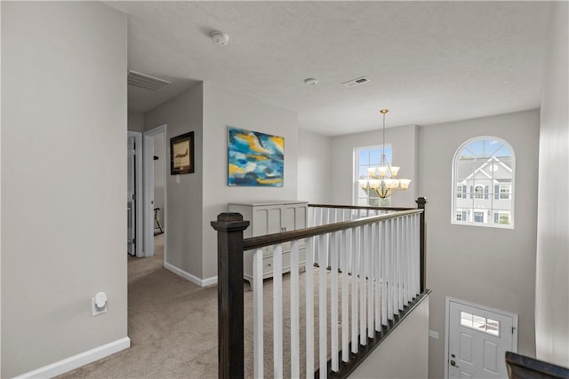 215 Saddle Ridge Dr, North Fayette, PA 15071 - stairway with carpet and a chandelier