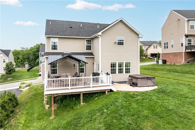 215 Saddle Ridge Dr, North Fayette, PA 15071 - back of property with a hot tub, a lawn, a deck, a patio area, and roof with shingles