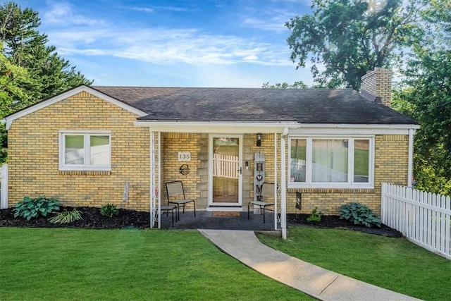 135 Taylor Run Rd, Carroll Twp, PA 15063 - bungalow-style home featuring brick siding, a chimney, covered porch, and a shingled roof