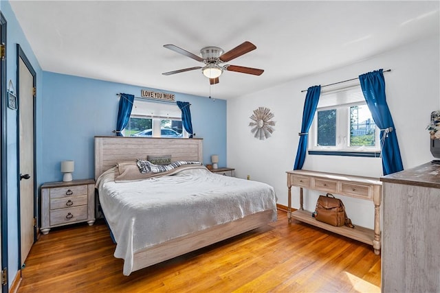 135 Taylor Run Rd, Carroll Twp, PA 15063 - bedroom with multiple windows, wood finished floors, and ceiling fan