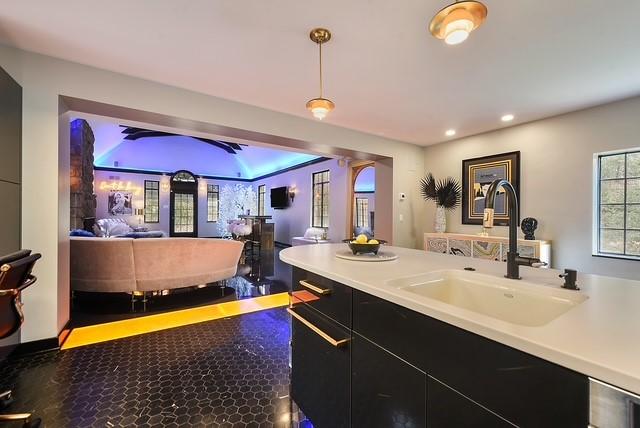1397 Abers Creek Rd, Monroeville, PA 15146 - kitchen with dark cabinetry, open floor plan, recessed lighting, light countertops, and hanging light fixtures