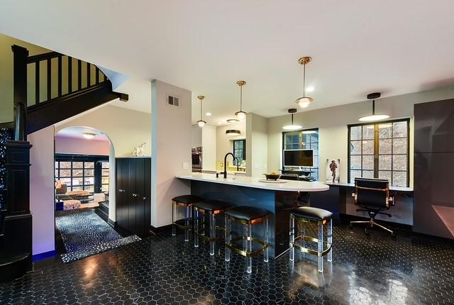 1397 Abers Creek Rd, Monroeville, PA 15146 - kitchen featuring oven, arched walkways, a kitchen bar, decorative light fixtures, and a peninsula