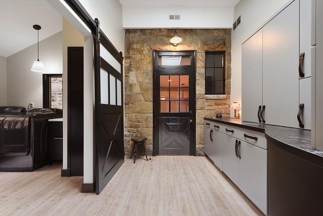 1397 Abers Creek Rd, Monroeville, PA 15146 - bar area featuring a barn door, washing machine and clothes dryer, light wood-style floors, and pendant lighting