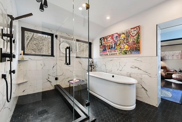 1397 Abers Creek Rd, Monroeville, PA 15146 - bathroom featuring tile walls, a freestanding tub, a marble finish shower, lofted ceiling, and recessed lighting
