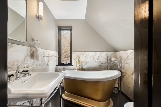 1397 Abers Creek Rd, Monroeville, PA 15146 - bathroom featuring tile walls, a soaking tub, lofted ceiling, and wainscoting