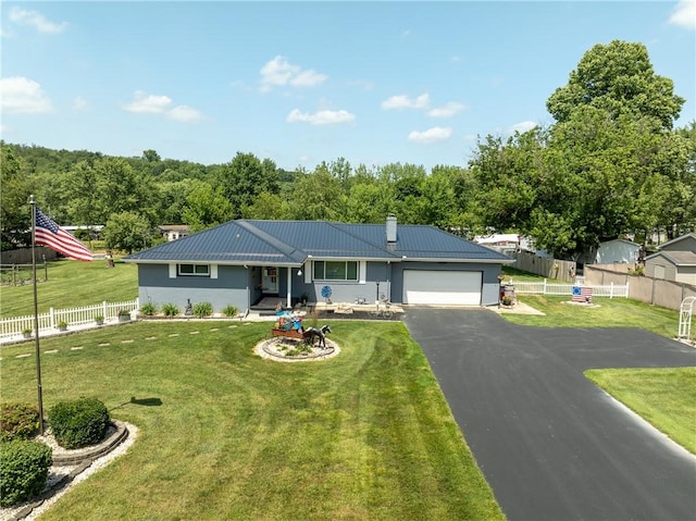 164 Seger Rd, Derry Twp, PA 15627 - single story home with a chimney, driveway, an attached garage, a metal roof, and stucco siding