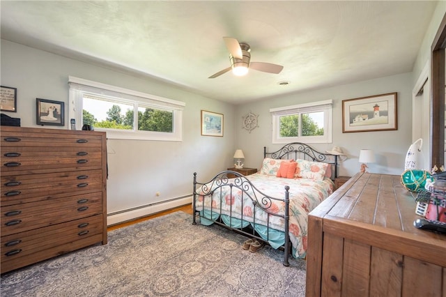 164 Seger Rd, Derry Twp, PA 15627 - bedroom featuring a baseboard radiator, ceiling fan, and wood finished floors