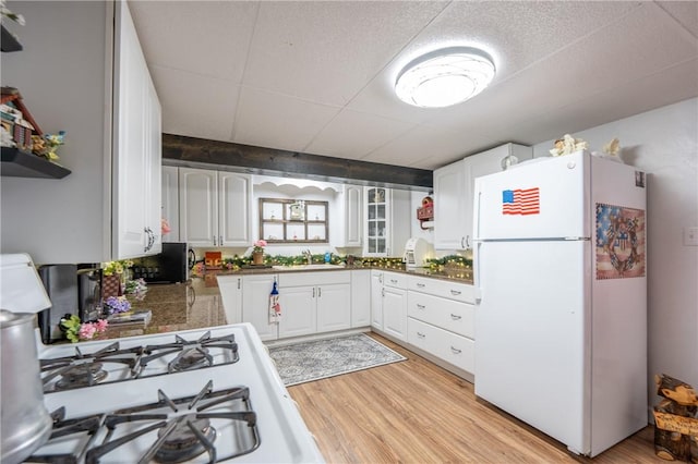 164 Seger Rd, Derry Twp, PA 15627 - kitchen featuring freestanding refrigerator, light wood finished floors, open shelves, and white cabinets