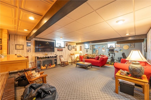 164 Seger Rd, Derry Twp, PA 15627 - carpeted living room featuring wood walls and a fireplace