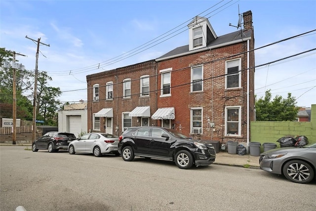 3520 Butler St, Lawrenceville, PA 15201 - townhome / multi-family property with brick siding and a chimney