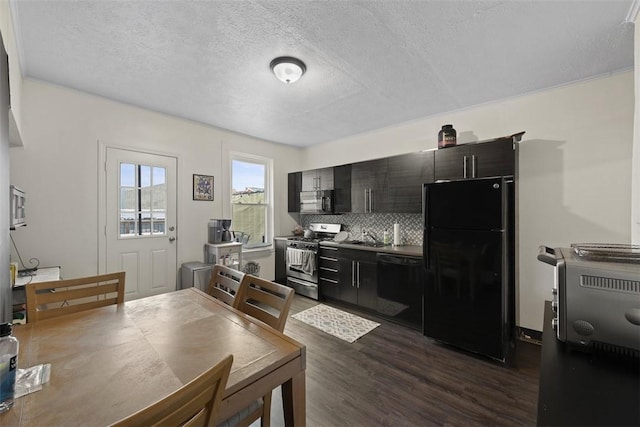 3520 Butler St, Lawrenceville, PA 15201 - kitchen with black appliances, dark wood finished floors, backsplash, a textured ceiling, and dark cabinetry