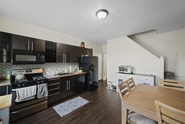 3520 Butler St, Lawrenceville, PA 15201 - kitchen with black appliances, decorative backsplash, dark wood-style floors, light countertops, and a textured ceiling