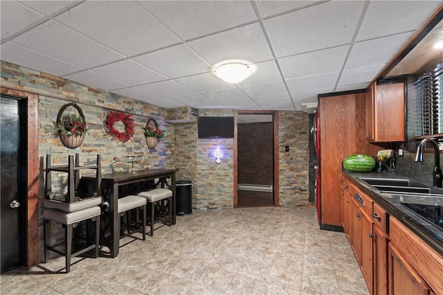 1402 Imperial Dr, Hopewell Twp Bea, PA 15001 - kitchen featuring a drop ceiling, dark countertops, and brown cabinetry