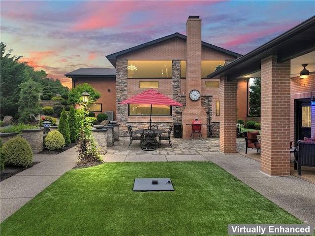 1402 Imperial Dr, Hopewell Twp Bea, PA 15001 - patio terrace at dusk featuring a patio and a yard