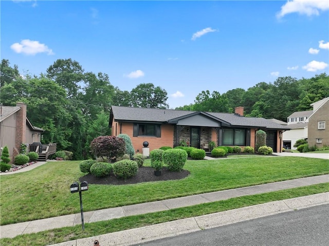 1402 Imperial Dr, Hopewell Twp Bea, PA 15001 - mid-century modern home with a garage, concrete driveway, a front lawn, and a chimney