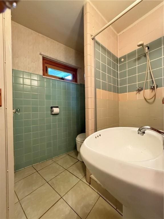 133 Hamburg Rd, Delaware Twp, PA 16154 - bathroom with tile walls, tile patterned flooring, and a stall shower