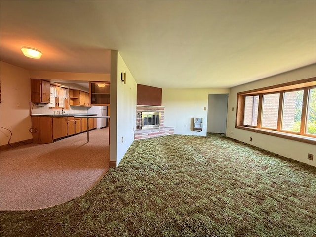 133 Hamburg Rd, Delaware Twp, PA 16154 - unfurnished living room featuring carpet floors and a fireplace