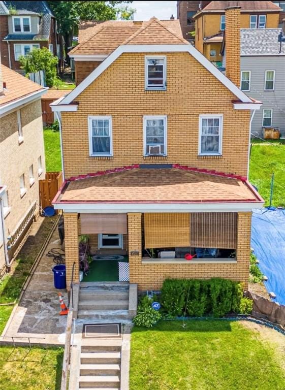 426 Saint Joseph St, Mount Oliver, PA 15210 - view of front of house with brick siding and a front yard