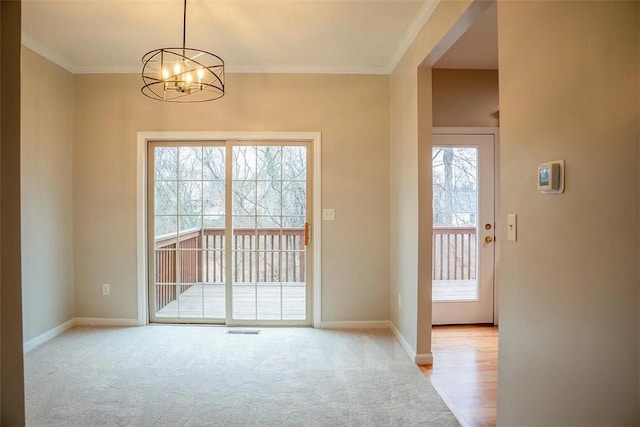 2426 Rochester Rd Unit C, Franklin Park, PA 15143 - doorway with a chandelier, light colored carpet, and ornamental molding
