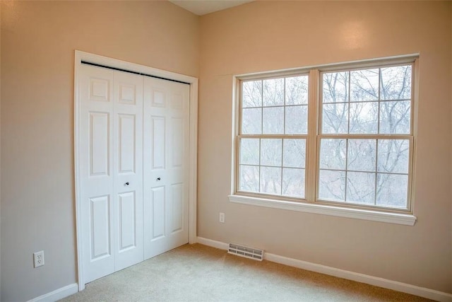 2426 Rochester Rd Unit C, Franklin Park, PA 15143 - unfurnished bedroom with carpet, multiple windows, and a closet