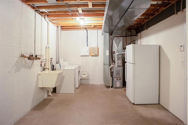 2426 Rochester Rd Unit C, Franklin Park, PA 15143 - unfinished below grade area with freestanding refrigerator, separate washer and dryer, heating unit, and concrete block wall