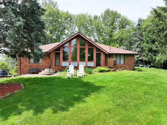 214 Labash Ln, Rostraver, PA 15012 - rear view of property featuring a yard and brick siding