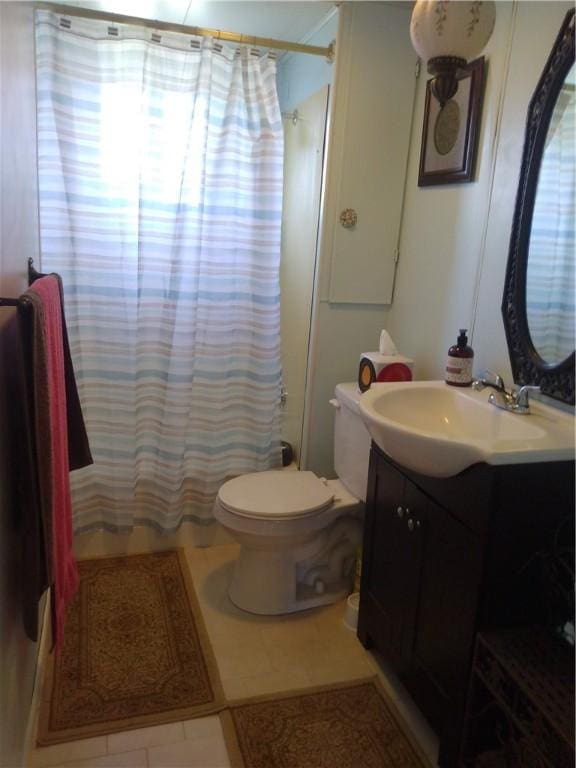 125 Bertha Ave, Donora, PA 15033 - bathroom featuring vanity, tile patterned floors, and curtained shower