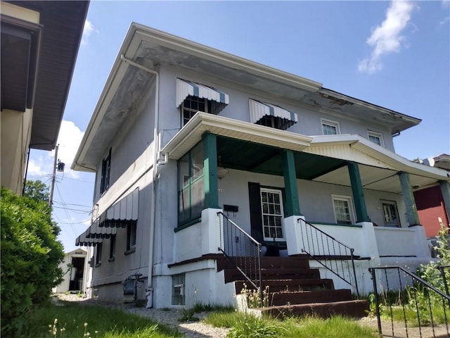 125 Bertha Ave, Donora, PA 15033 - view of front of home featuring stucco siding and covered porch