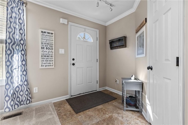 102 Castle View Dr, Kennedy Twp, PA 15136 - foyer entrance featuring ornamental molding, rail lighting, and light stone finish flooring