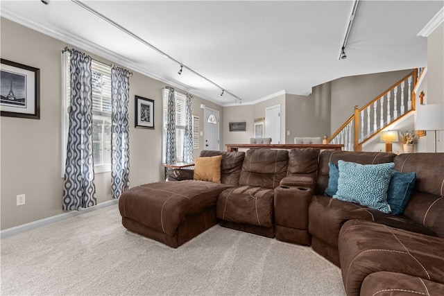 102 Castle View Dr, Kennedy Twp, PA 15136 - carpeted living area featuring track lighting, crown molding, and stairs
