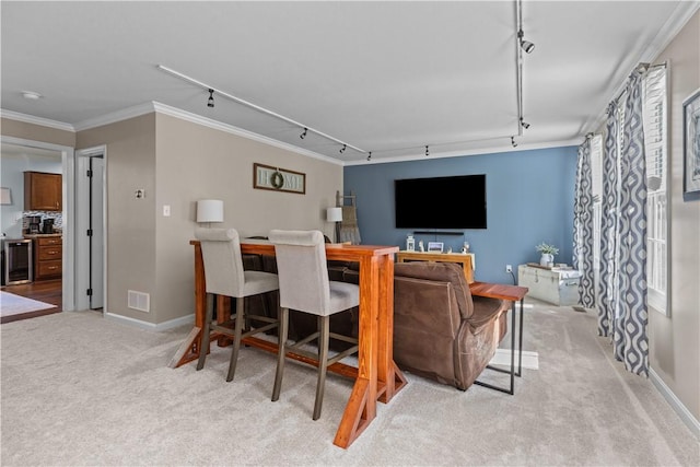 102 Castle View Dr, Kennedy Twp, PA 15136 - living room with rail lighting, light colored carpet, wine cooler, and crown molding