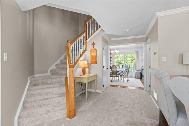 102 Castle View Dr, Kennedy Twp, PA 15136 - stairway with carpet flooring, a chandelier, and ornamental molding
