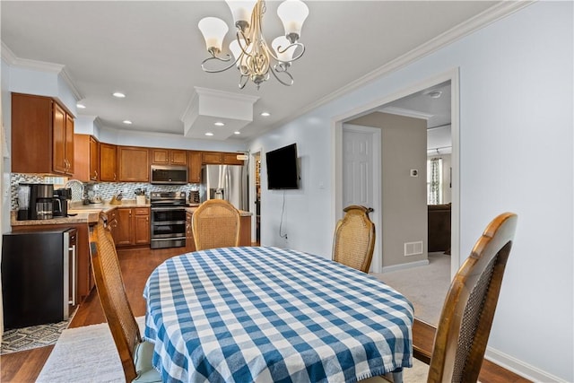 102 Castle View Dr, Kennedy Twp, PA 15136 - dining room featuring ornamental molding, a chandelier, recessed lighting, and dark wood finished floors