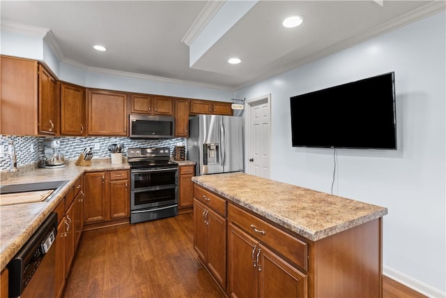 102 Castle View Dr, Kennedy Twp, PA 15136 - kitchen with stainless steel appliances, dark wood-style flooring, brown cabinetry, crown molding, and light countertops
