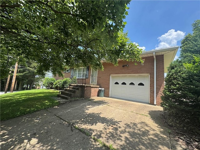 11 Edith St, Center Twp/Homer Cty, PA 15748 - view of property hidden behind natural elements featuring brick siding, driveway, a garage, and a front yard