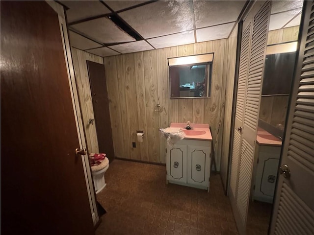 11 Edith St, Center Twp/Homer Cty, PA 15748 - bathroom featuring vanity, wooden walls, a closet, and a drop ceiling