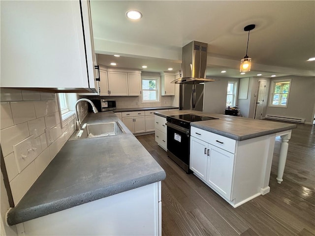 324 Hoover St, Saint Clair Twp, PA 15954 - kitchen with appliances with stainless steel finishes, island range hood, baseboard heating, dark wood-style flooring, and recessed lighting