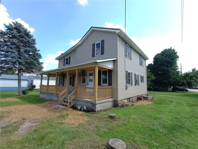324 Hoover St, Saint Clair Twp, PA 15954 - view of front of property featuring covered porch and a front yard