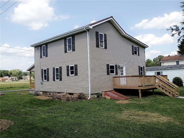 324 Hoover St, Saint Clair Twp, PA 15954 - back of property with a wooden deck and a lawn