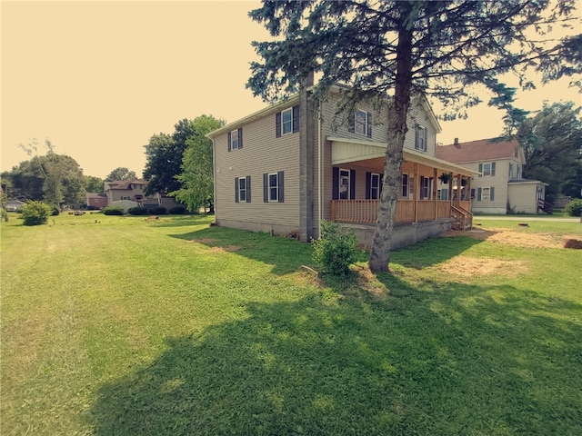 324 Hoover St, Saint Clair Twp, PA 15954 - view of side of property with covered porch and a lawn