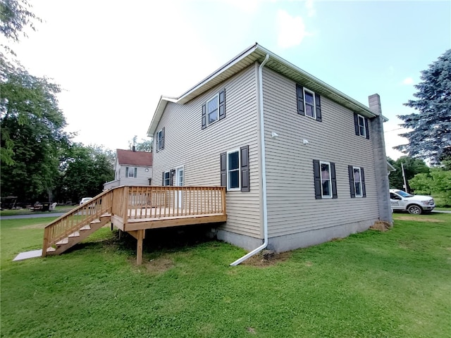 324 Hoover St, Saint Clair Twp, PA 15954 - back of property with a yard, a deck, and a chimney