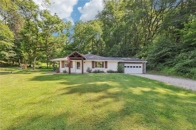 476 Trees Mills Rd, Salem Twp, PA 15601 - ranch-style home featuring gravel driveway, an attached garage, and a front yard