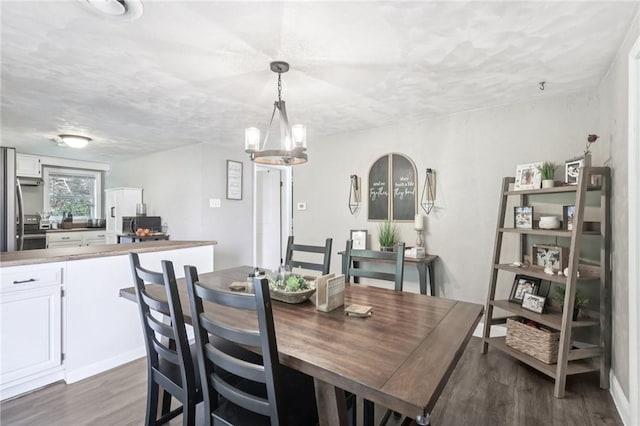476 Trees Mills Rd, Salem Twp, PA 15601 - dining space with dark wood-style floors and a chandelier