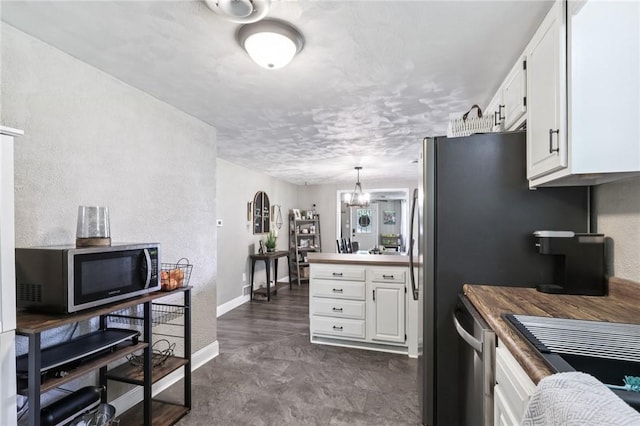476 Trees Mills Rd, Salem Twp, PA 15601 - kitchen with white cabinets, a chandelier, dishwasher, and decorative light fixtures