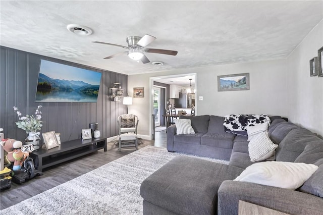 476 Trees Mills Rd, Salem Twp, PA 15601 - living room with wood finished floors, a ceiling fan, and a chandelier