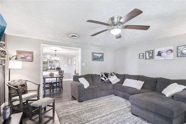 476 Trees Mills Rd, Salem Twp, PA 15601 - living room with wood finished floors, a chandelier, and a ceiling fan