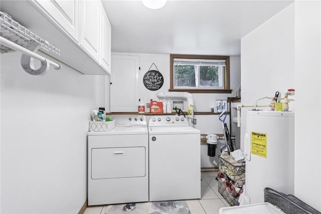 476 Trees Mills Rd, Salem Twp, PA 15601 - laundry area with electric water heater, cabinet space, washer and dryer, and light tile patterned floors