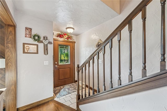 227 Holly Pl, Mount Pleasant Twp Wml, PA 15666 - entrance foyer with stairs and wood finished floors