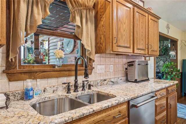 227 Holly Pl, Mount Pleasant Twp Wml, PA 15666 - kitchen featuring dishwasher, brown cabinetry, decorative backsplash, and light stone counters
