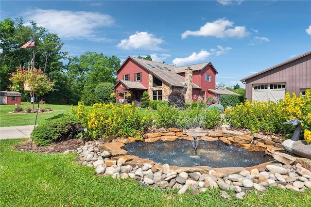 227 Holly Pl, Mount Pleasant Twp Wml, PA 15666 - view of front of home with a garden pond